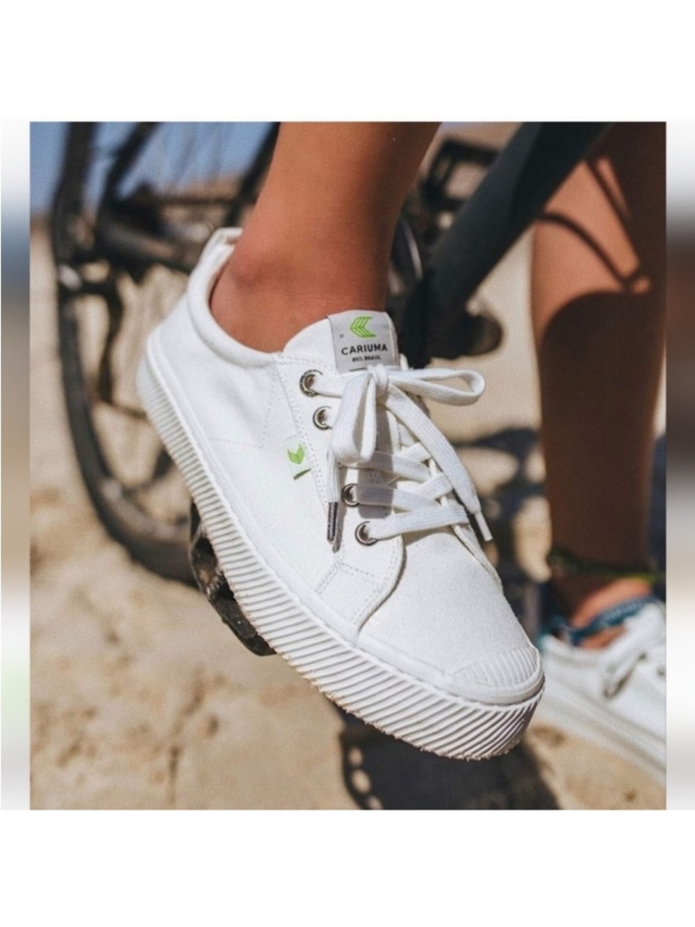 Cariuma Women’s White Canvas Sneakers with Green Logo Accent